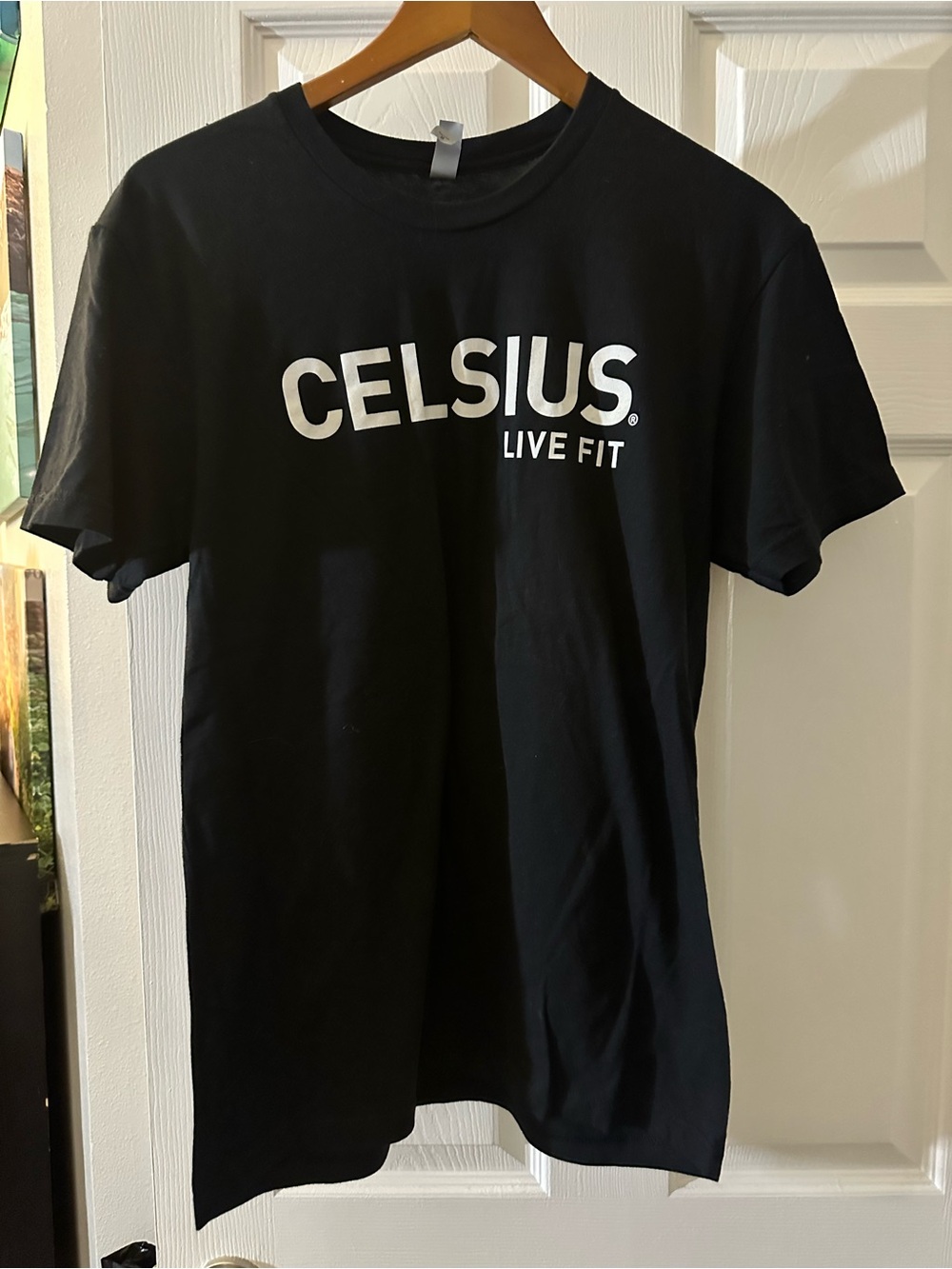 Next Level Apparel Black T‑Shirt with White 'CELSIUS Live Fit' Logo